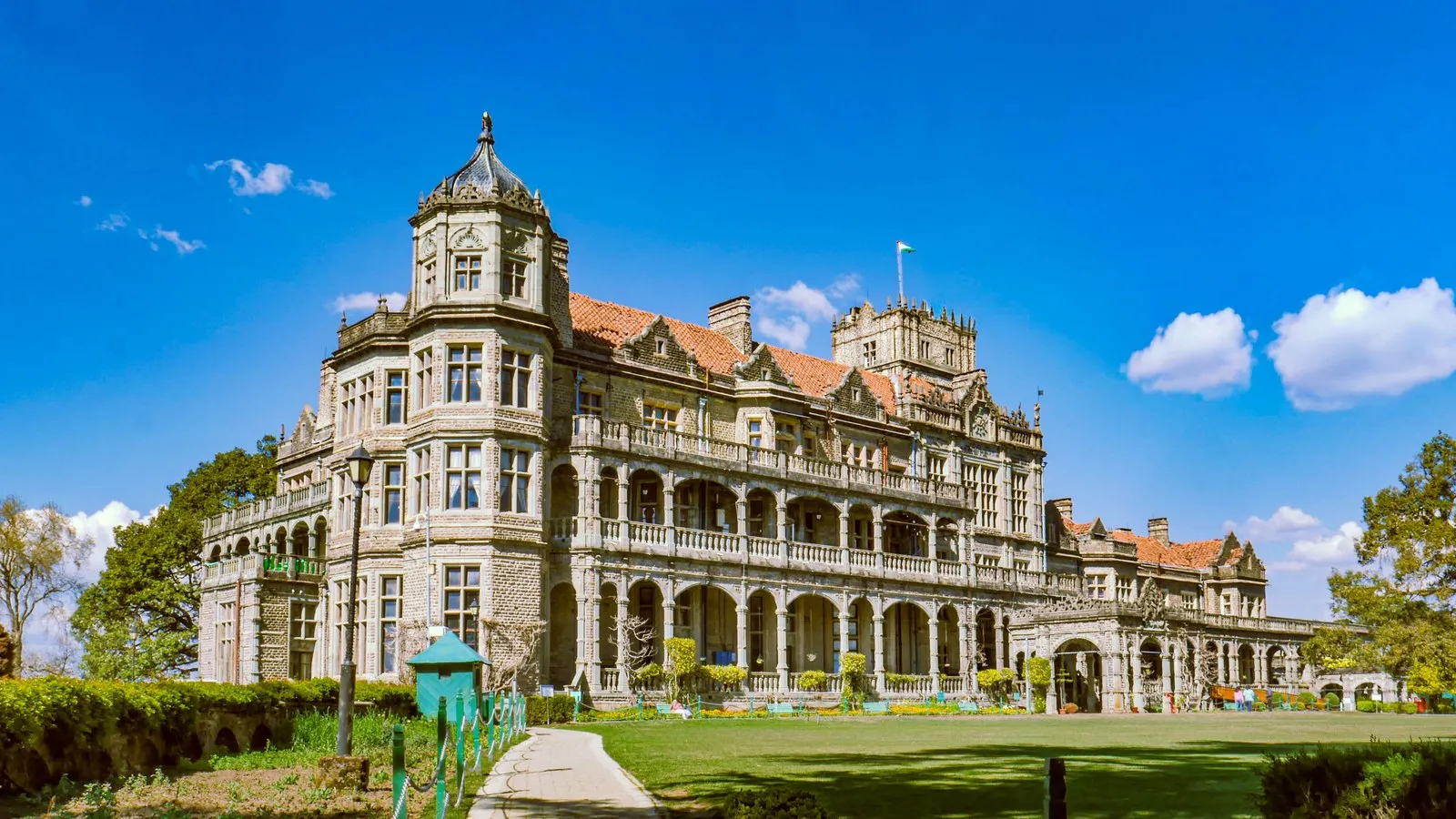 The Viceregal Lodge in Shimla, grey stone and gables above its lawns