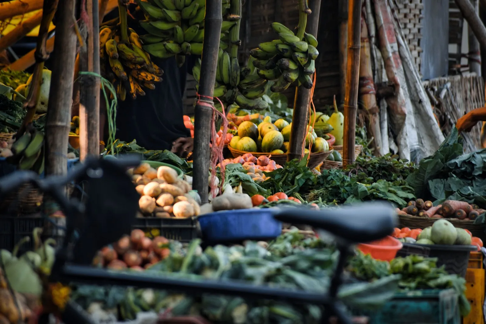 Fruit and vegetables piled high at a market stall in Odisha