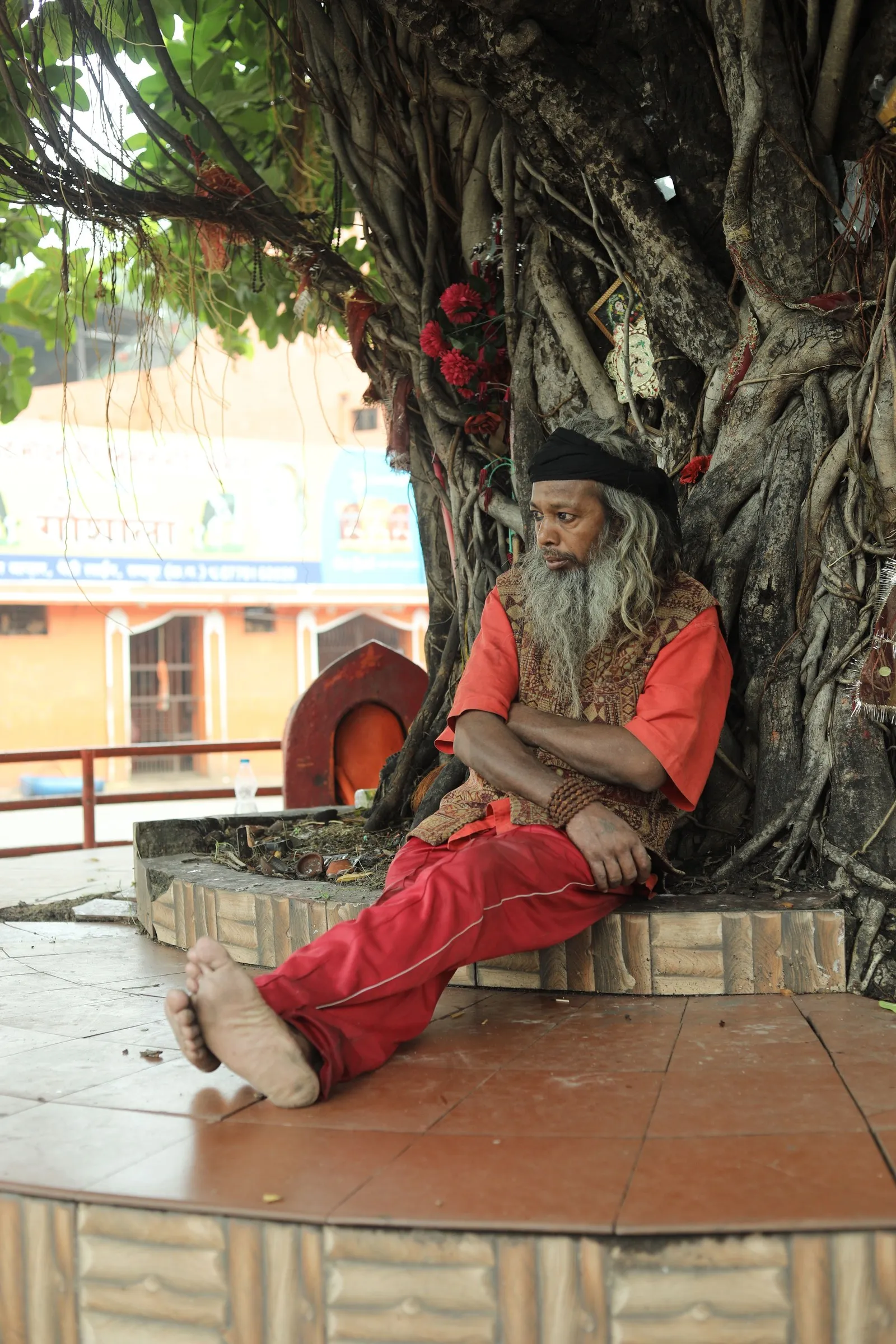 A sadhu resting under a banyan tree in Raipur