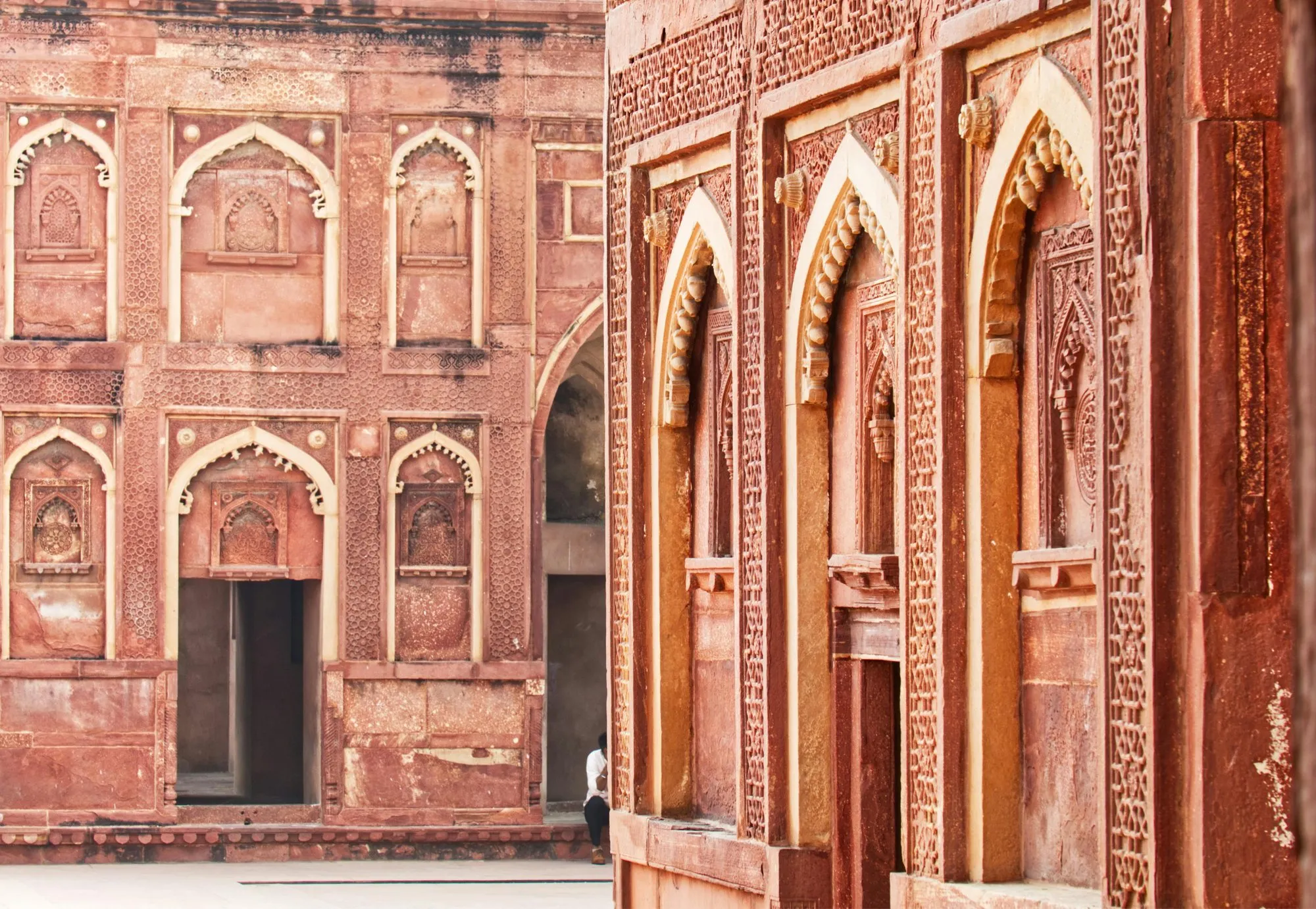 Carved red sandstone arches