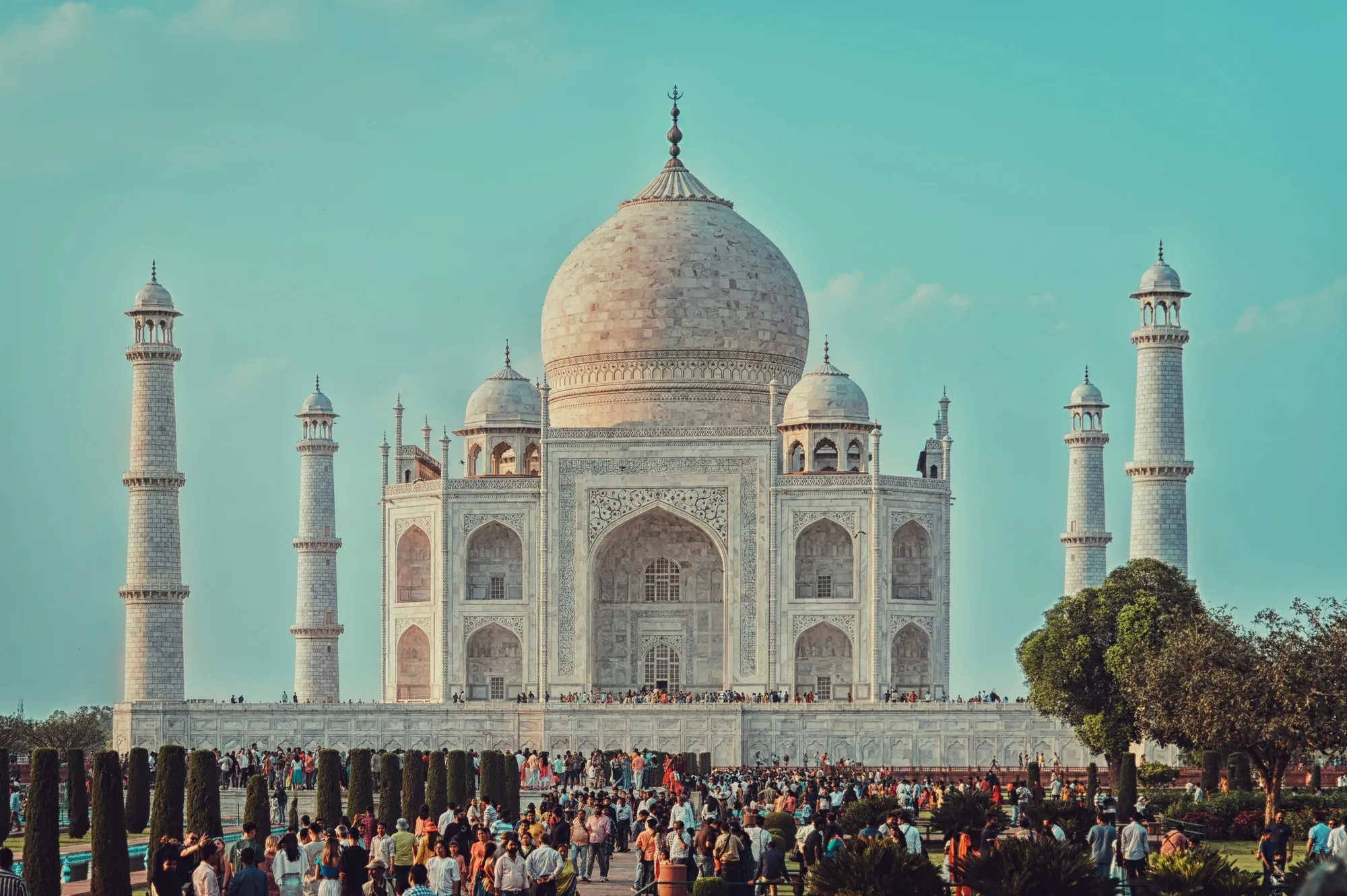The Taj Mahal and a crowd in its garden