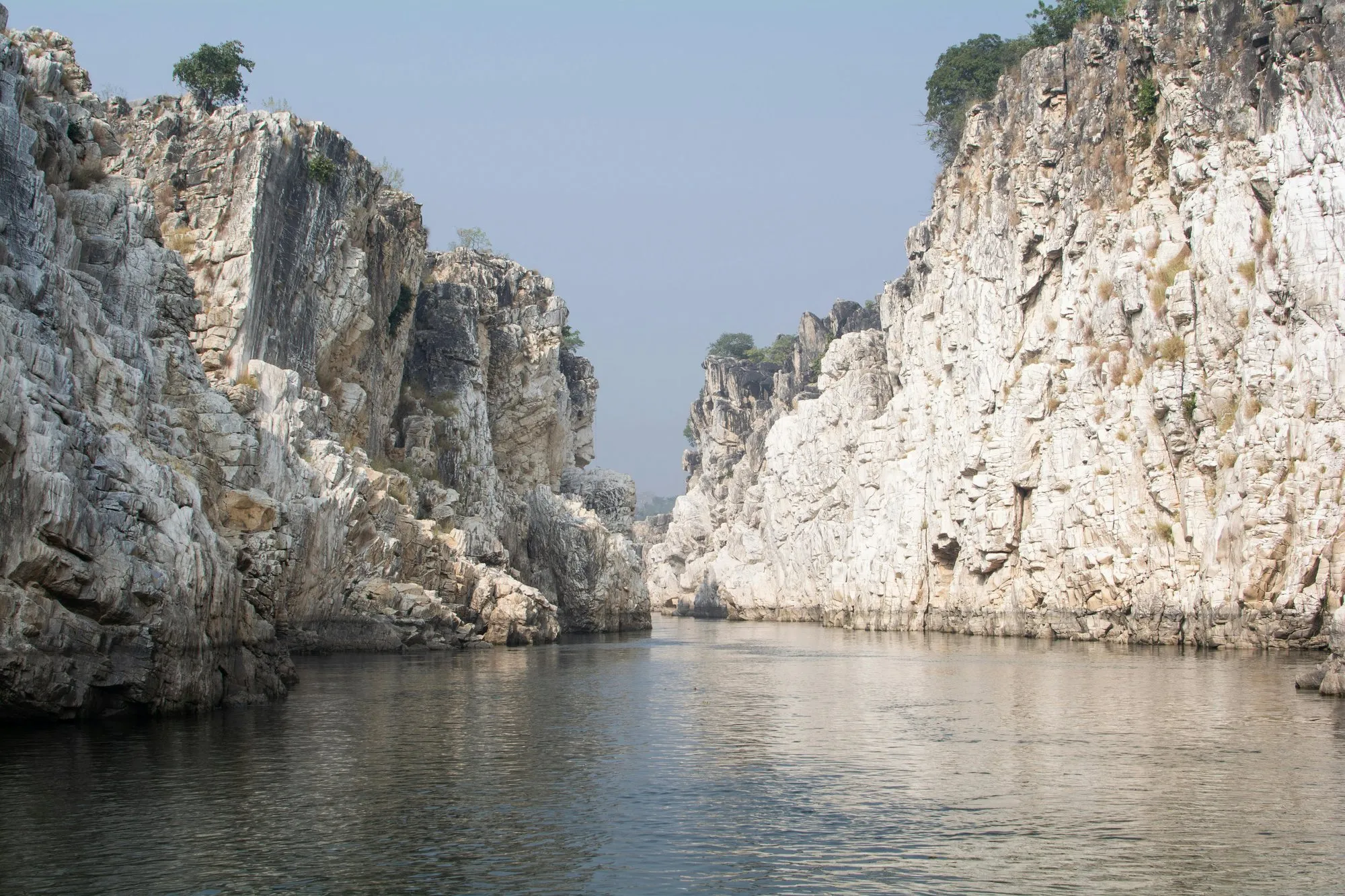 White marble cliffs above a still river