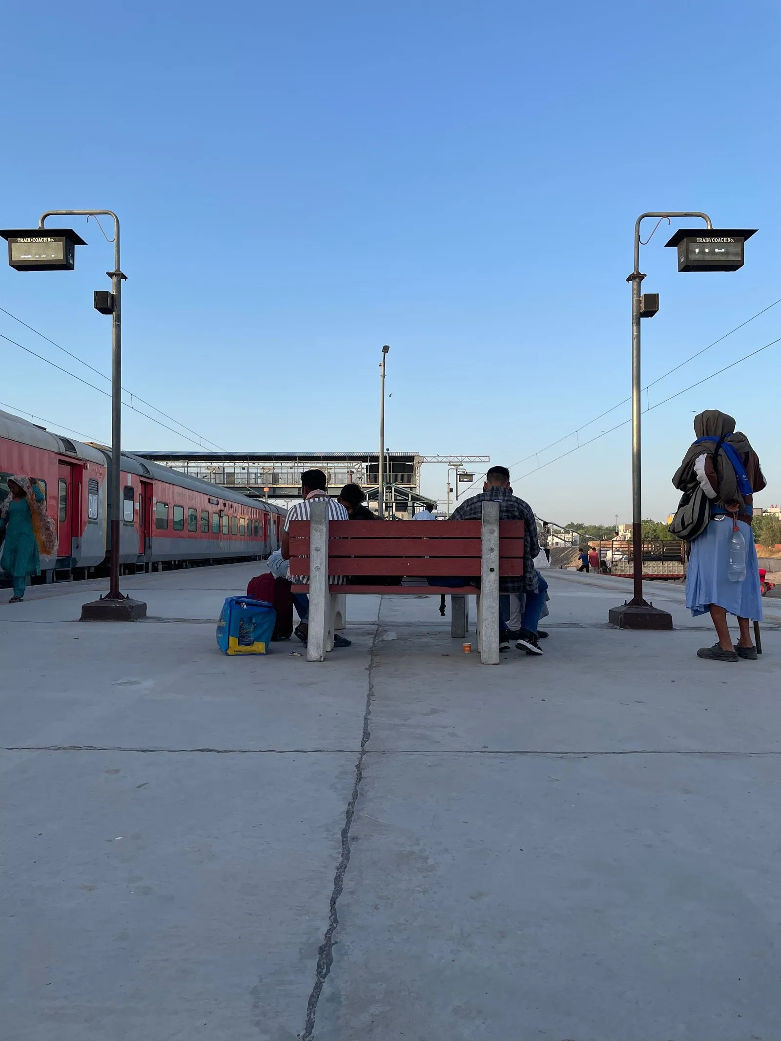Passengers waiting for a train at a village station in Rajasthan