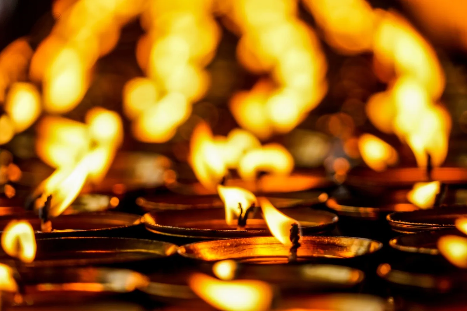 Rows of lamps burning as offerings in Thimphu