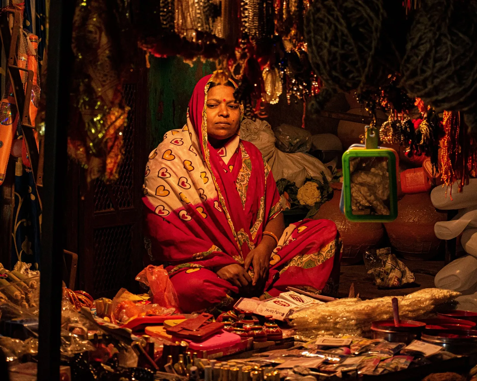 A woman minding her stall of bangles and trinkets at a market in Bihar