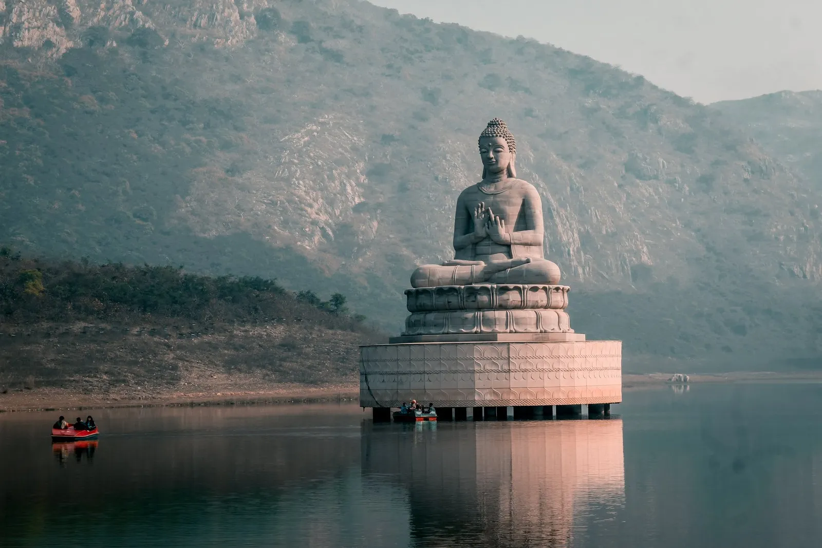 The stone Buddha in Ghora Katora lake, Rajgir, in the morning mist