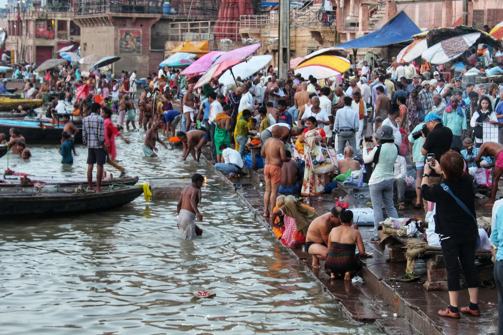 Pilgrims bathing in the Ganga from the ghats of Varanasi