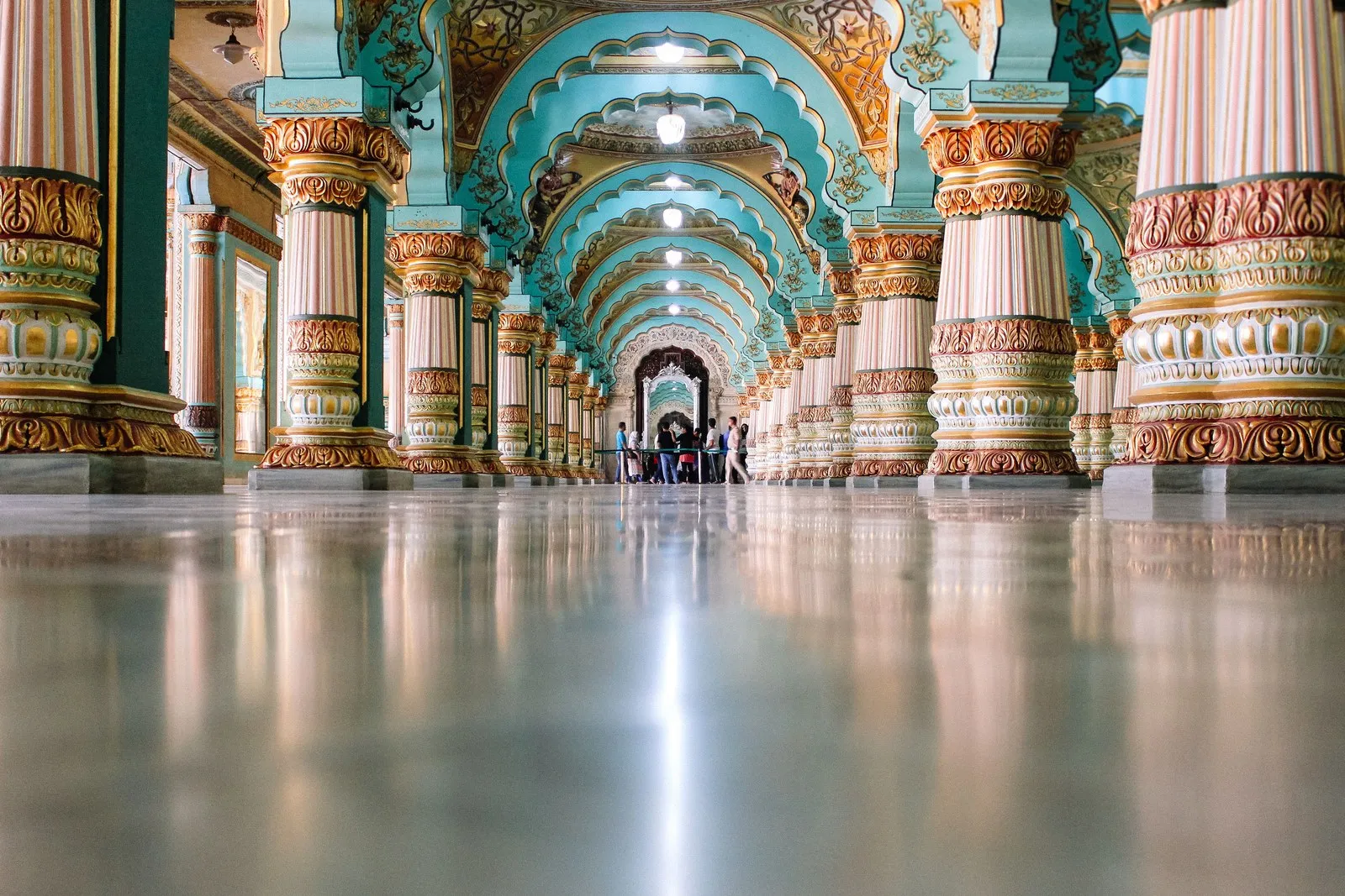 The painted columns and arches of the Durbar Hall in the Mysore Palace
