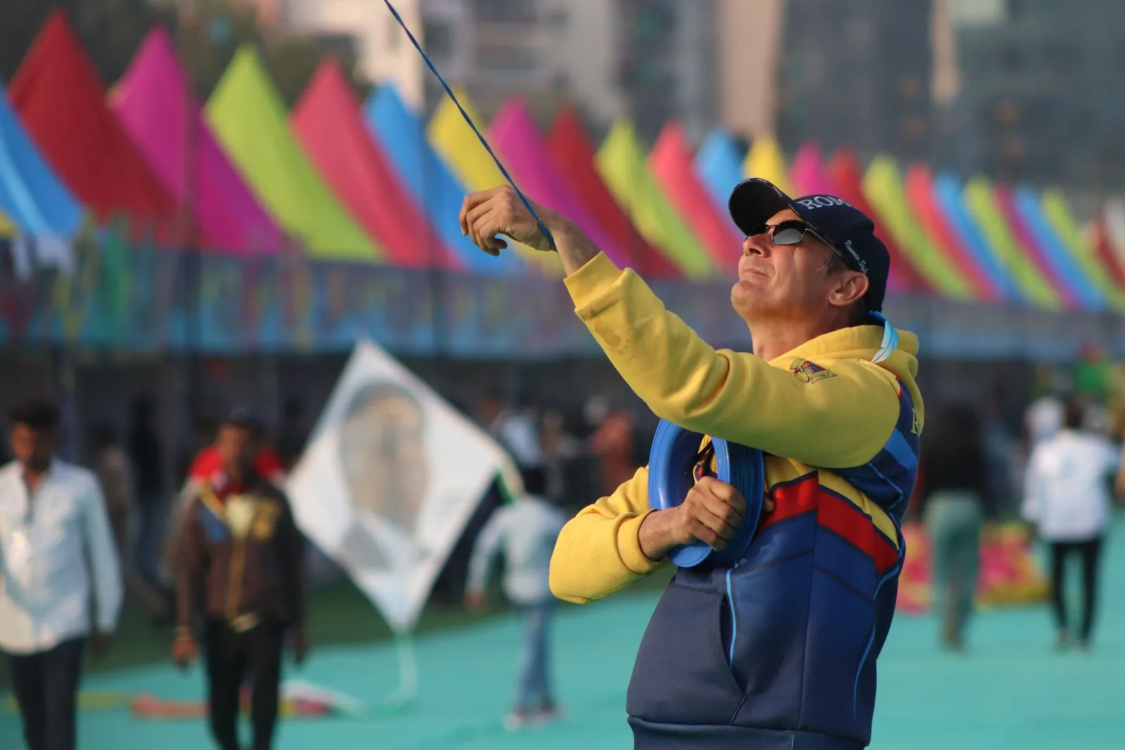 A man flying a kite at the kite festival in Ahmedabad