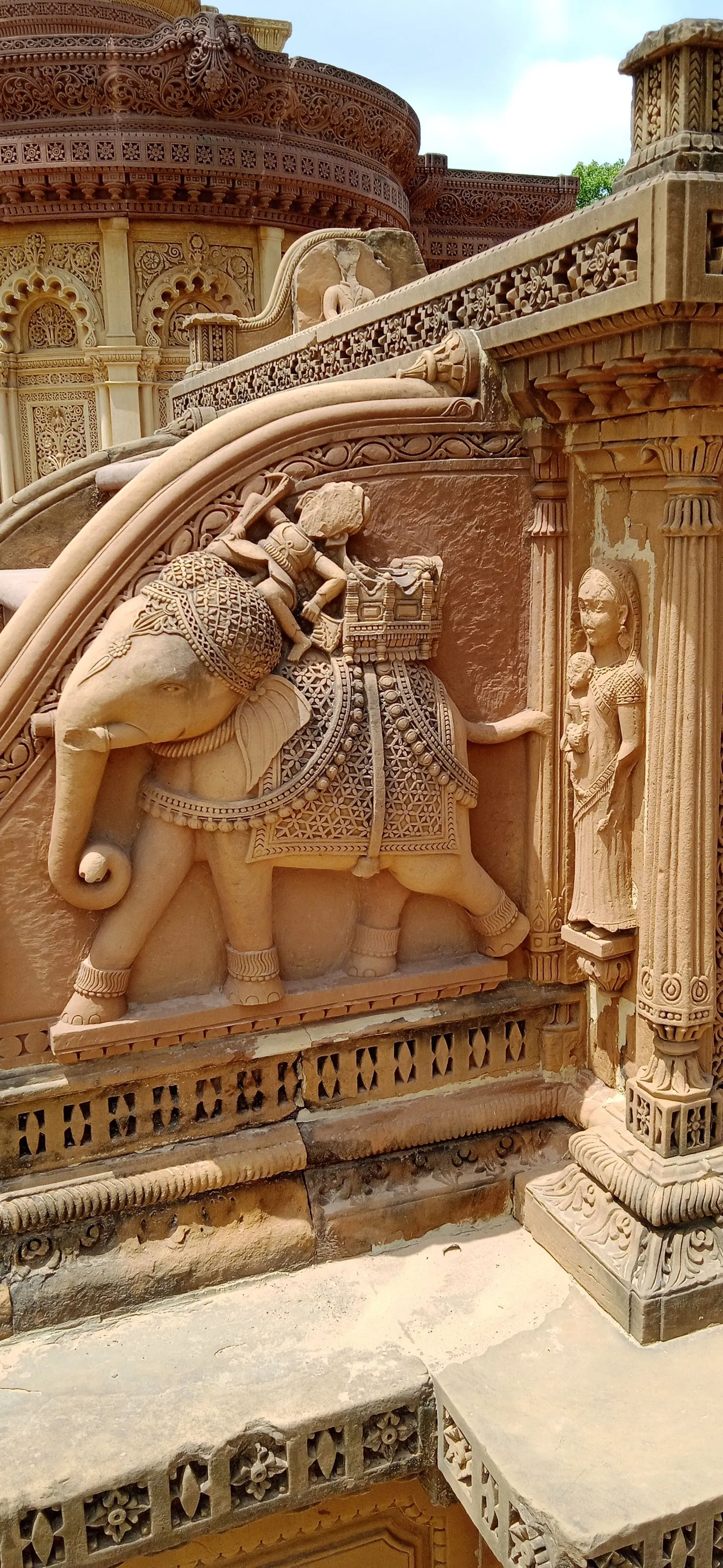 A carved stone elephant on a temple wall in Bhuj