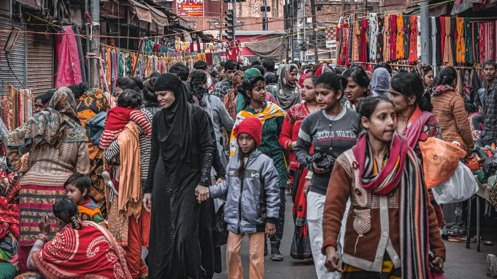 Shoppers crowding a market street in Guwahati, Assam