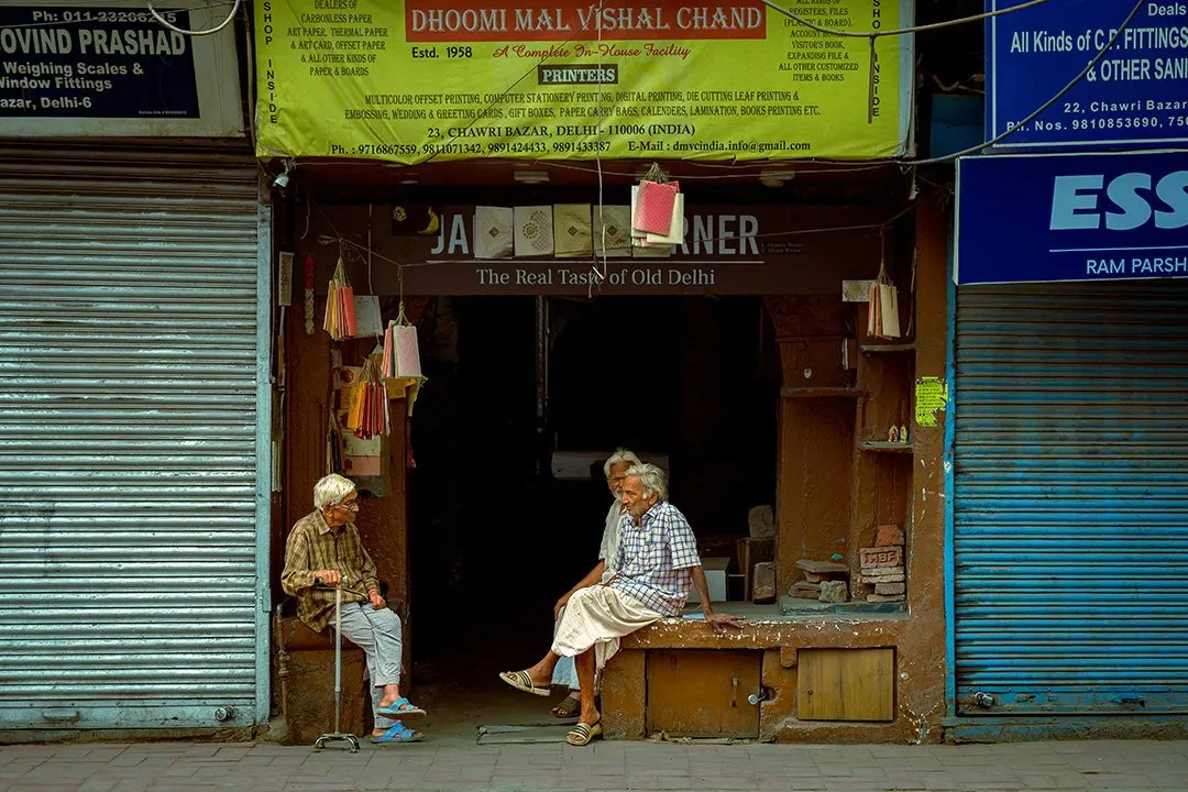 Two men outside a shop in Old Delhi