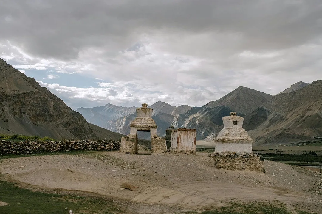 Chortens standing in a wide Ladakhi valley