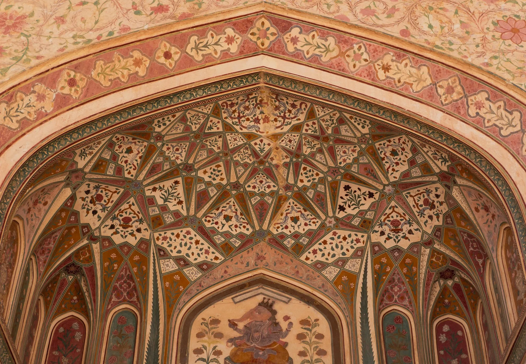 A painted arch of floral frescoes at Amber