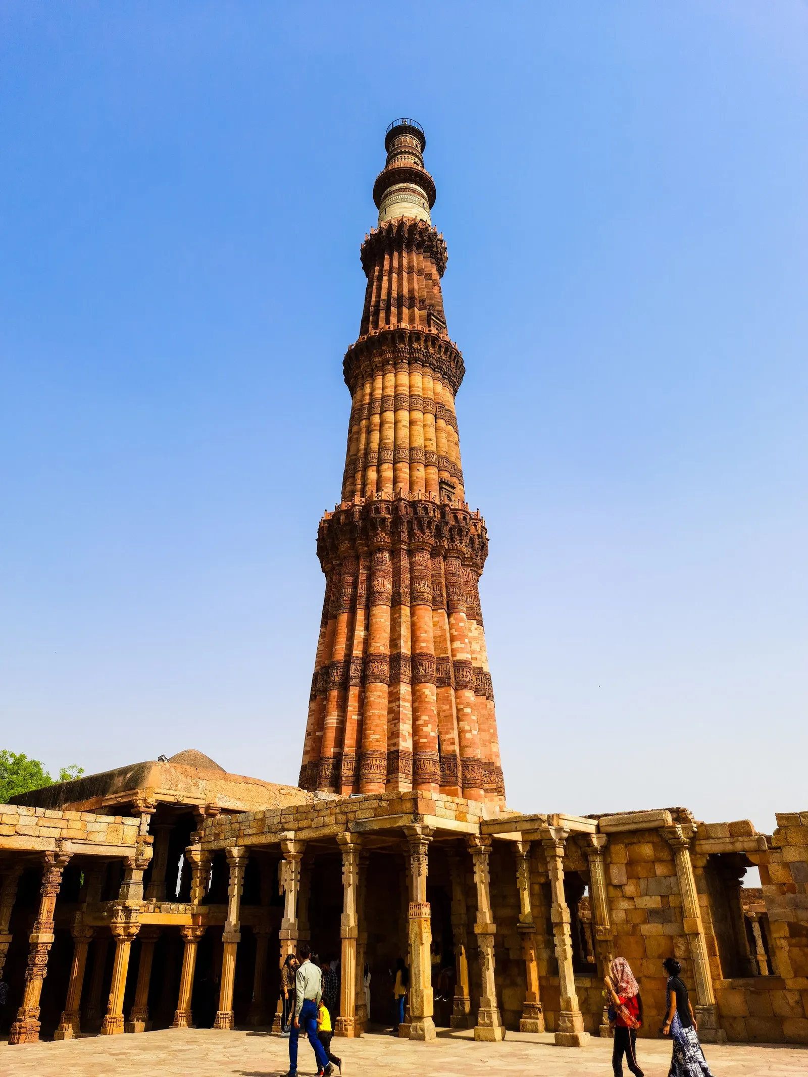 The Qutub Minar above the colonnades of its ruined mosque, Delhi