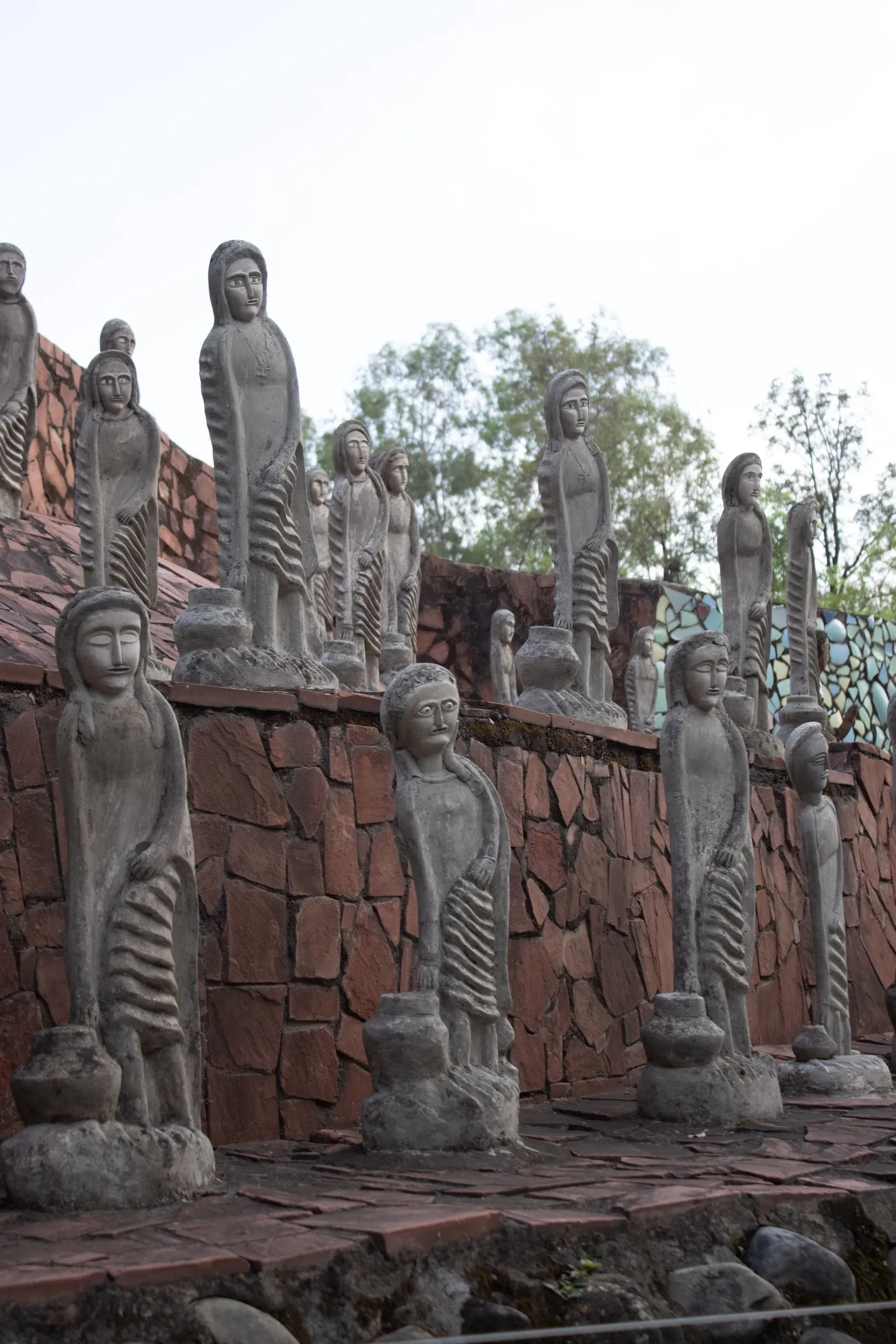 Rows of sculpted figures in Nek Chand’s Rock Garden, Chandigarh